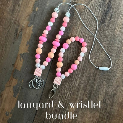 Pink and white silicone bead lanyard with matching wristlet bundle! Optional phone attachment can be added! Perfect gift for teachers nurses healthcare professionals. Great lanyard and wristlet keychain for teens and high school students.