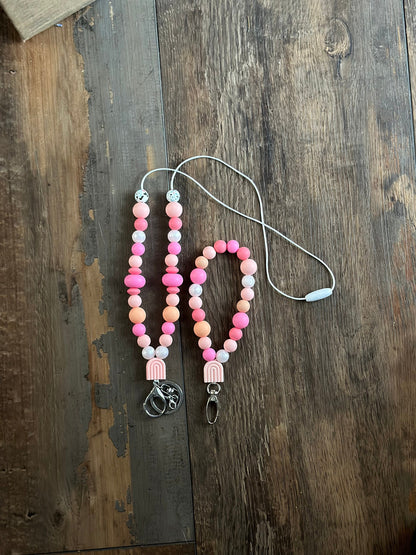 Cute pink silicone bead lanyard with soft, quality silicone beads adorable focal bead and clasp options id badge lanyard with break away clasp for teachers nurses and professionals adult pink and iridescent pearl silicone beads. Silk cord for comfort