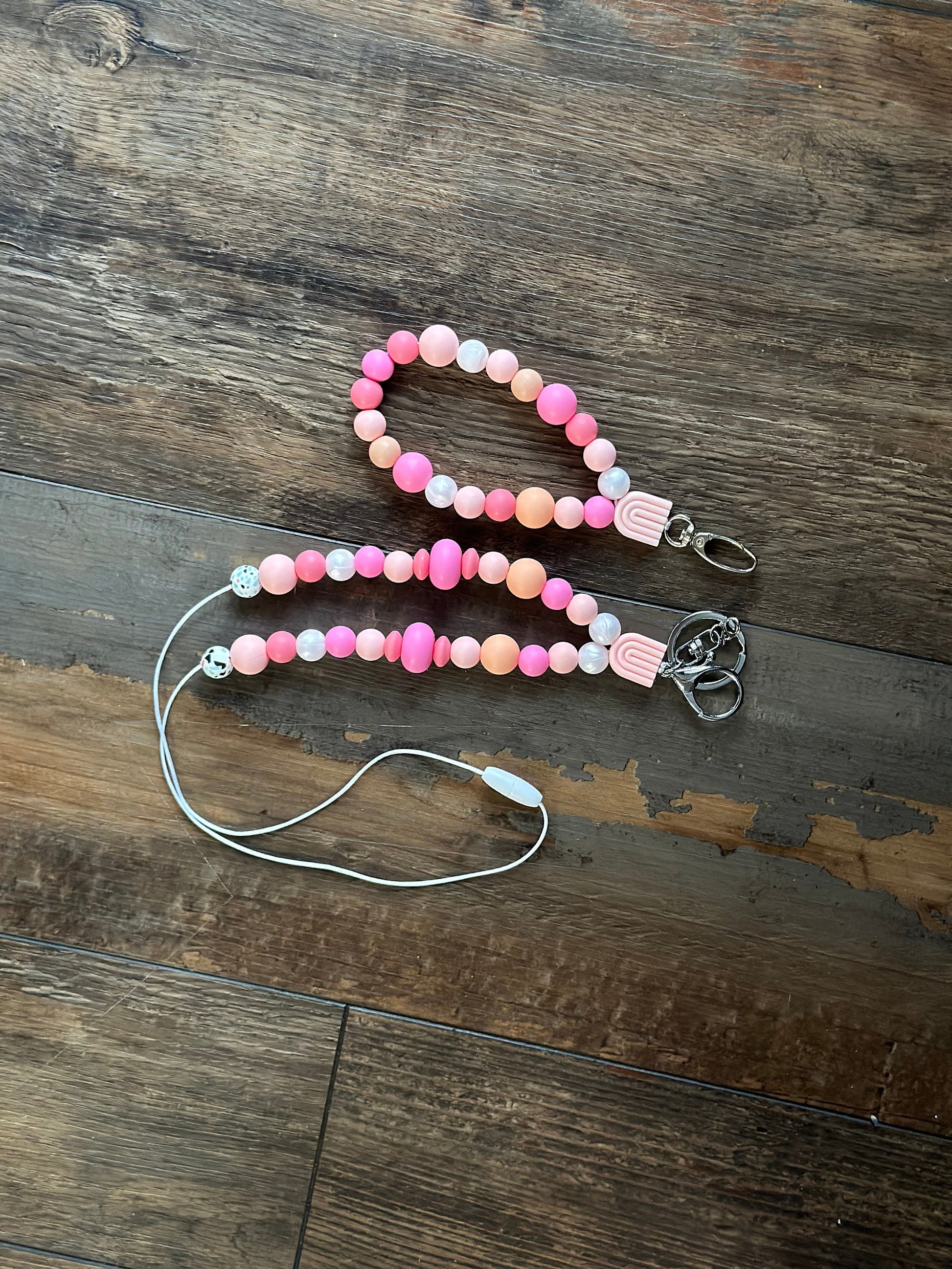 Cute pink silicone bead lanyard with soft, quality silicone beads adorable focal bead and clasp options id badge lanyard with break away clasp for teachers nurses and professionals adult pink and iridescent pearl silicone beads. Silk cord for comfort