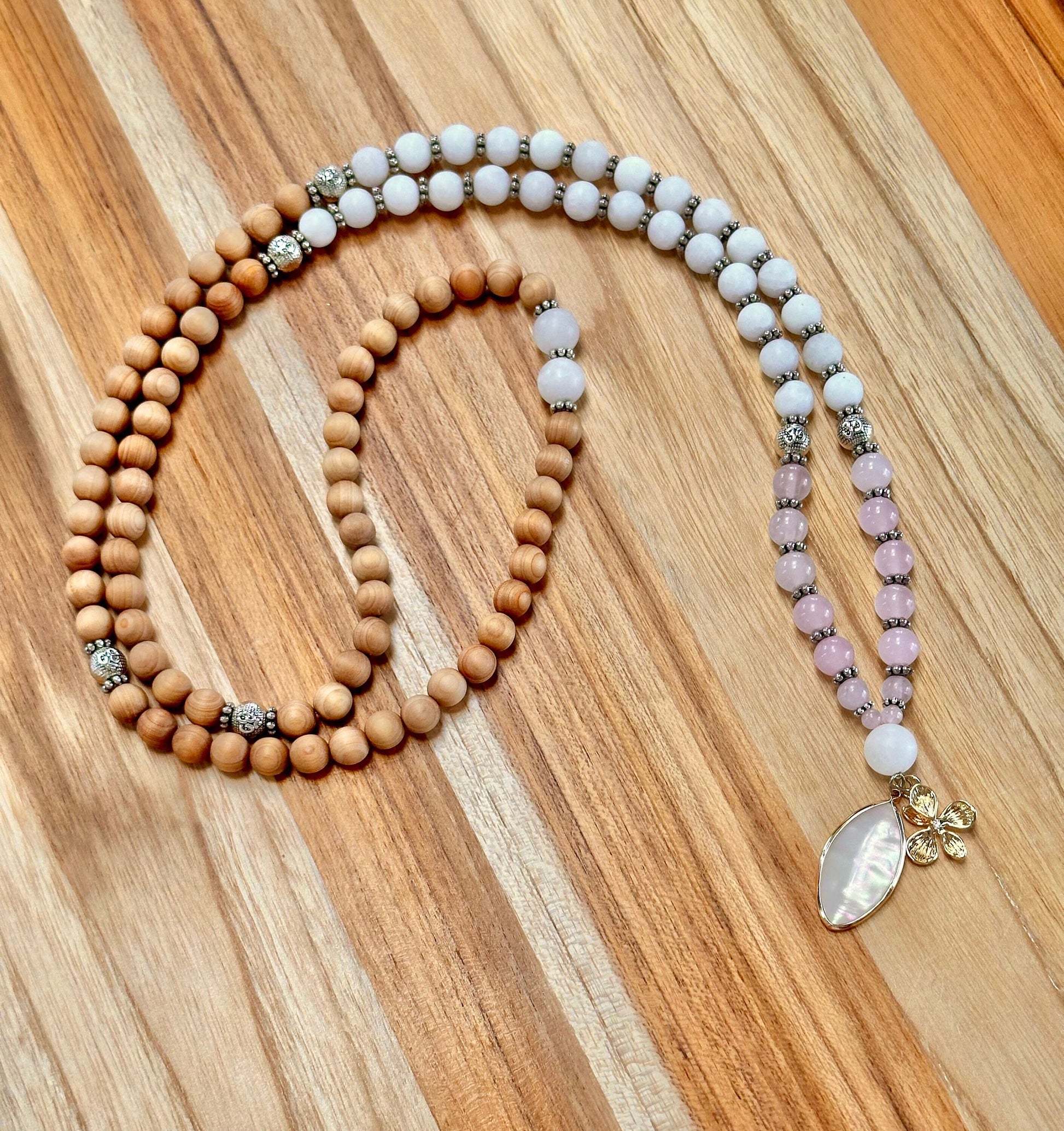108 bead mala necklace mediation yoga practice jewelry made with white jade pink rose quartz alabaster and thuja wood. Perfect gift for her, gift for yoga lovers